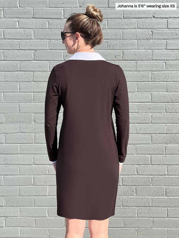 Woman standing with her back towards the camera showing the back of Miik's Adelaide collared long sleeve dress in brown.