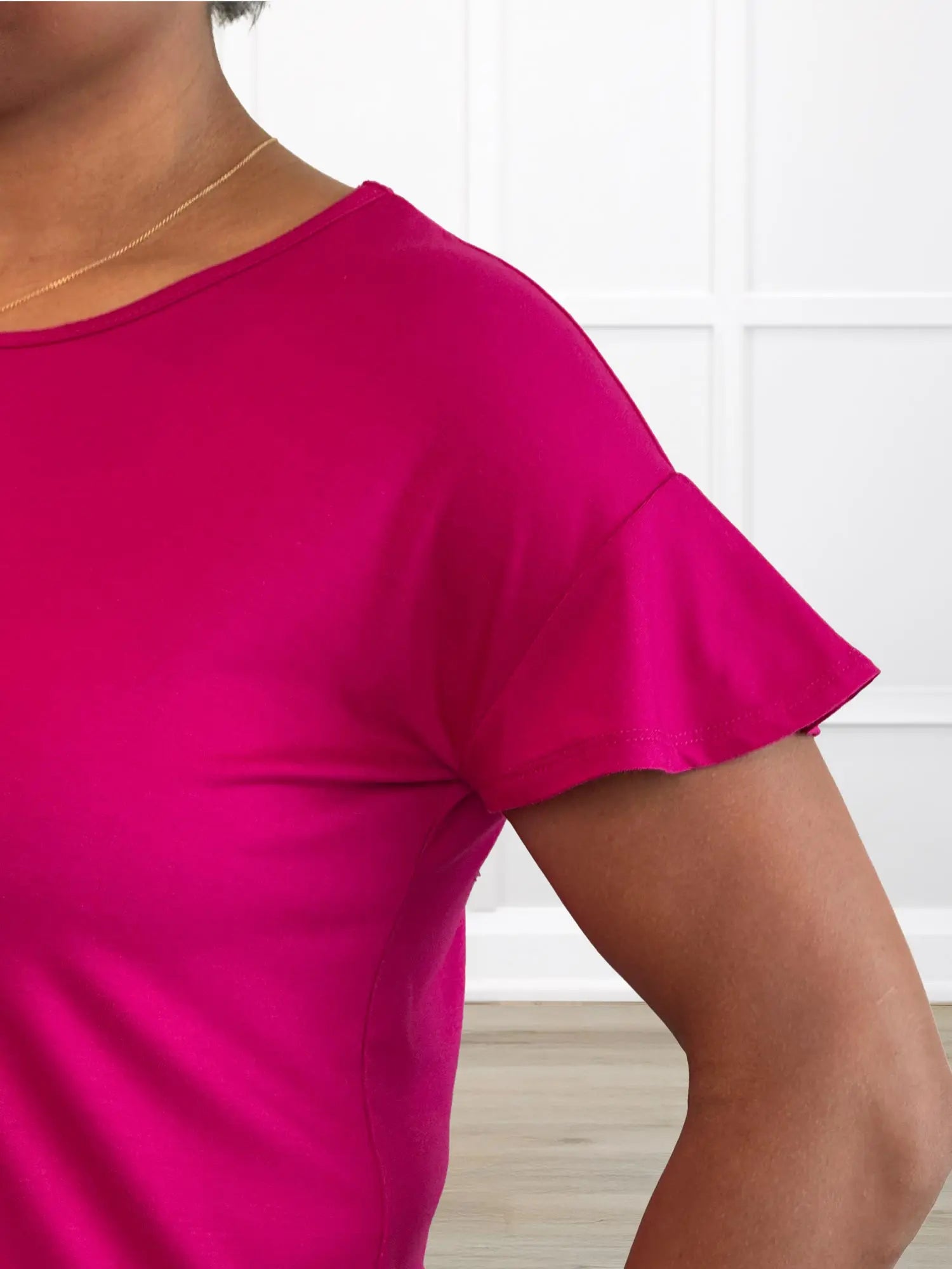 Close-up of detail of Miiks Allegra flutter sleeve knot top ruffled sleeves 