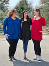 Miik models Carley, Yasmine and Christal smiling while looking at each other all showing different ways to wear Miik's Alma half sleeve pocket tunic