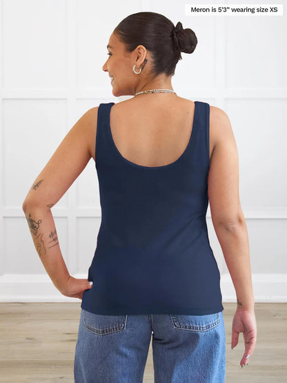Miik model Meron (5’3”, xsmall) standing with her back towards the camera showing the back of Miik&