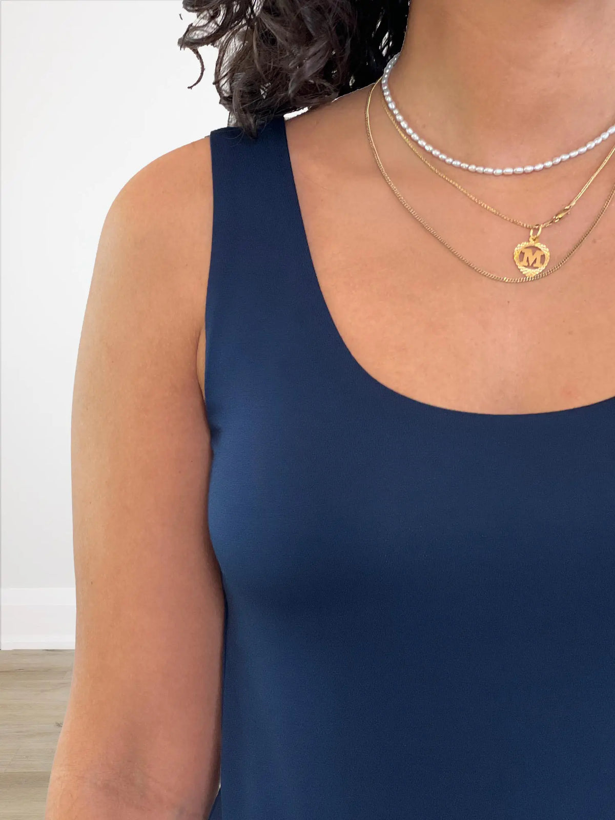 A closeup of the scoop neckline of Miik&