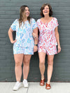Miik founder Donna and model Christal smiling while standing in front of a brick wall wearing Miik's Amita PJ lounge set. Donna is wearing in the sunset leaf print while Christal is wearing the ocean leaf