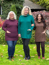 Miik models Colleen, Carolyn and Yasmine standing next to each other smiling showing the different sizes and colours of Miik's 		Ashanti long sleeve cowl neck pocket tunic: port melange, jade melange and chocolate melange 