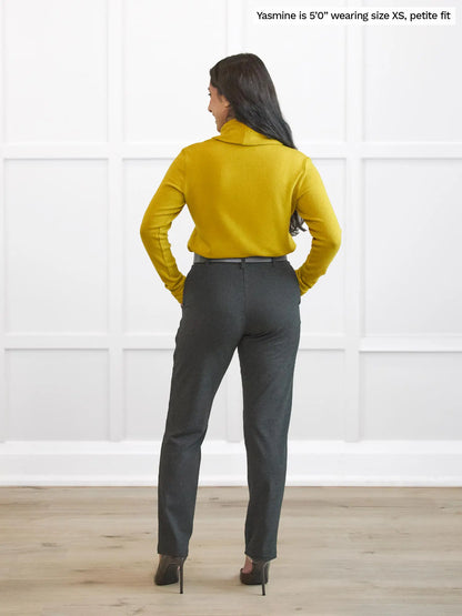Miik model Yasmine (5’0”, xsmall, petite fit) standing with her back towards the camera showing the back of Miik&
