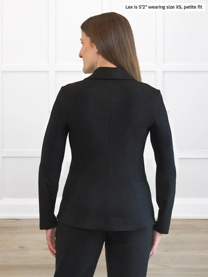 Miik model Lex (5’2”, small)  standing with her back towards the camera showing the back of Miik&