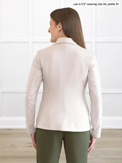 Miik model Lex (5’2”, small)  standing with her back towards the camera showing the back of Miik&