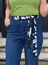 A close up image of Miik's Blair bamboo tie waist belt in white lily print 