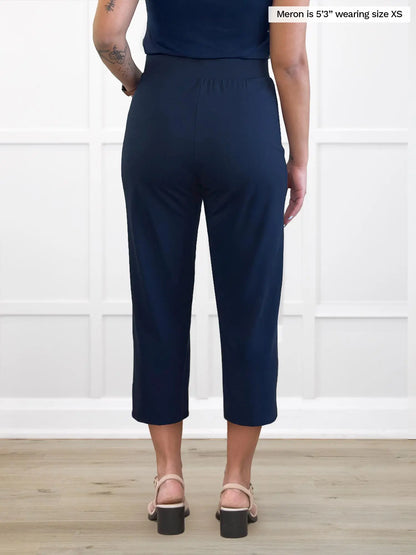 Miik model Meron (5’3”, xsmall) standing with her back towards the camera showing the back of Miik&