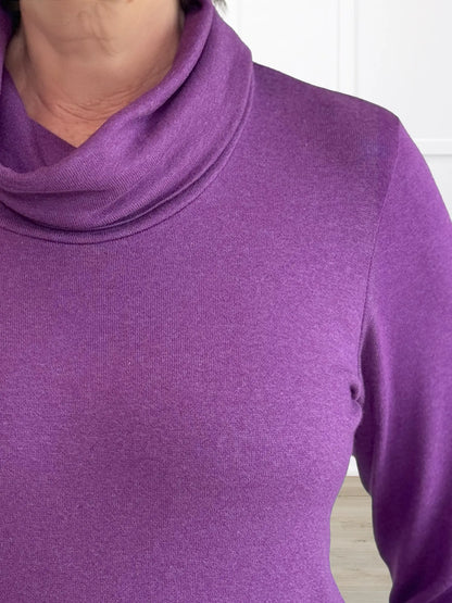 A closeup detail of the neckline of Miik&