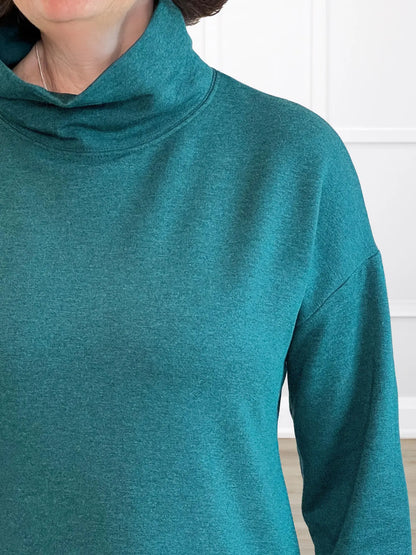 A closeup detail shot of the cowl neckline of Miik&