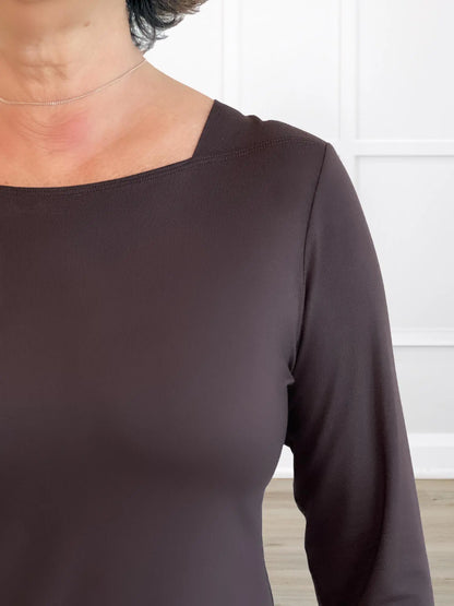 A closeup detail of the neckline of Miik&