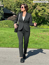 Miik founder Donna (size small, 5 foot 6) wearing the Emily soft blazer buttond in charcoal grey as a professional suit with matching tailored pants.