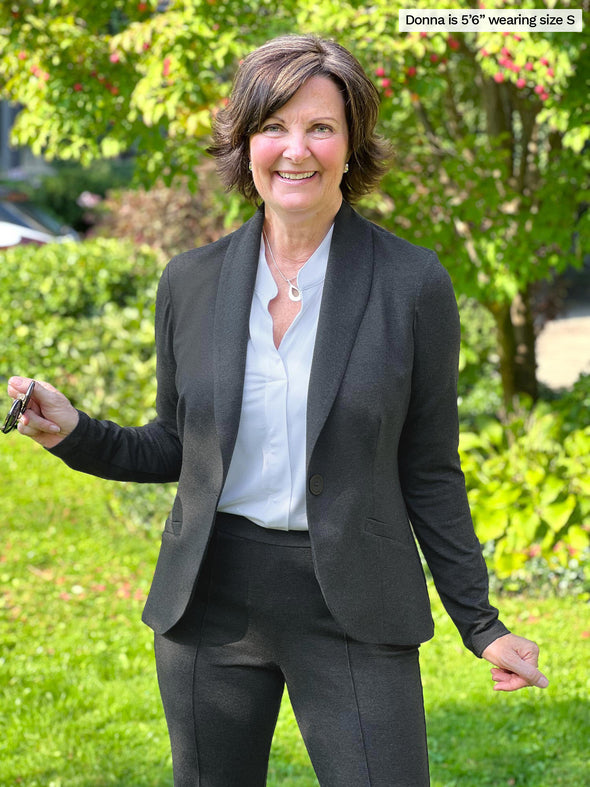 Miik founder Donna (size small, 5 foot 6) wearing the Emily soft blazer in charcoal grey as a suit with matching tailored pants and a white corporate shirt.