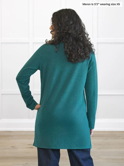 Miik model Meron (5’3”, xsmall) standing with her back towards the camera showing the back of Miik&