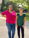 Miik plus size model Sarita standing next to Miik model Meron both wearing different versions of a classic v-neck tee of Miik 