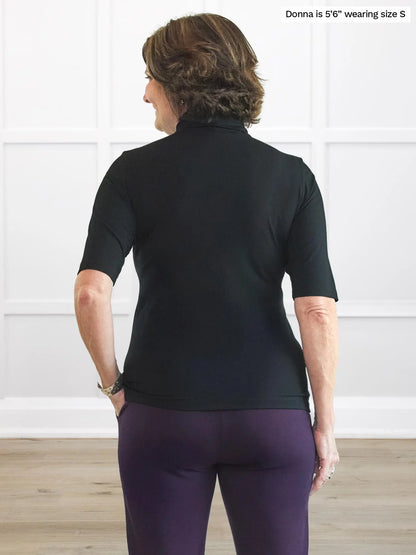 Miik founder Donna (5’6”, small) standing with her back towards the camera showing the back of Miik&