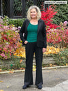 Miik model Carolyn (5'10, large, tall) smiling wearing Miik's Jeremy high waisted wide leg ponte pant