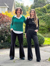 Miik founder Donna and model Johanna standing next to each other smiling wearing Miik's Jeremy high waisted wide leg ponte pant in black