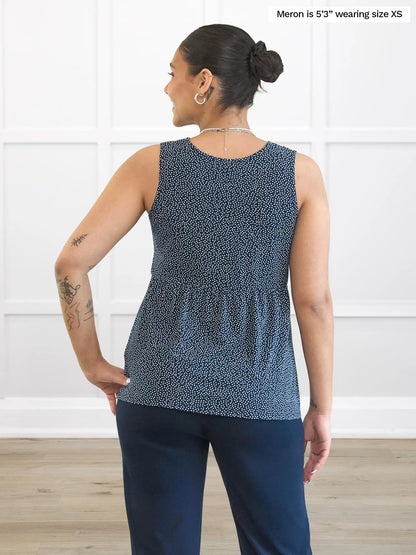 Miik model Meron (5’3”, xsmall) standing with her back towards the camera showing the back of Miik&