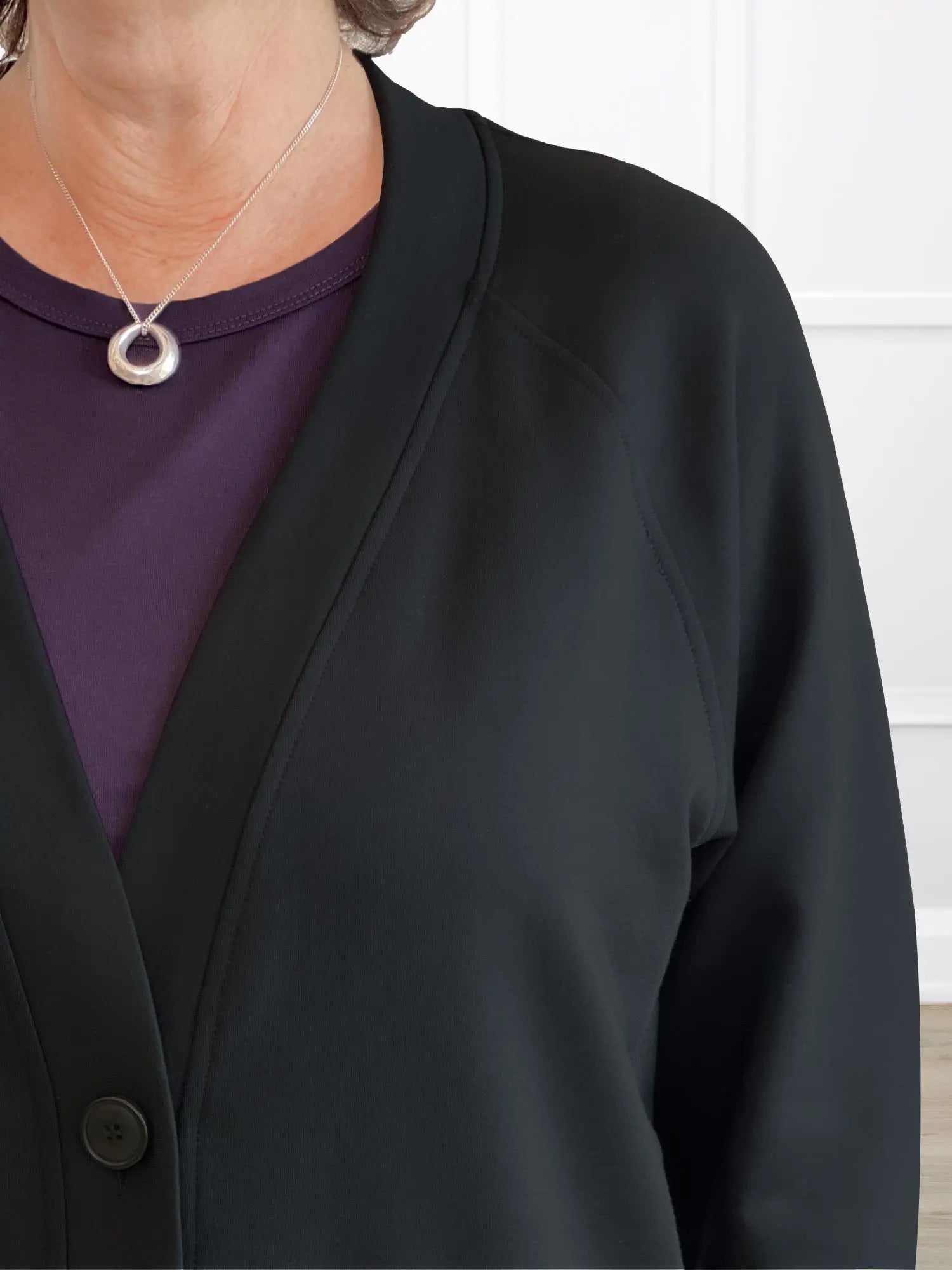 A closeup detail shot of the neckline of Miik&