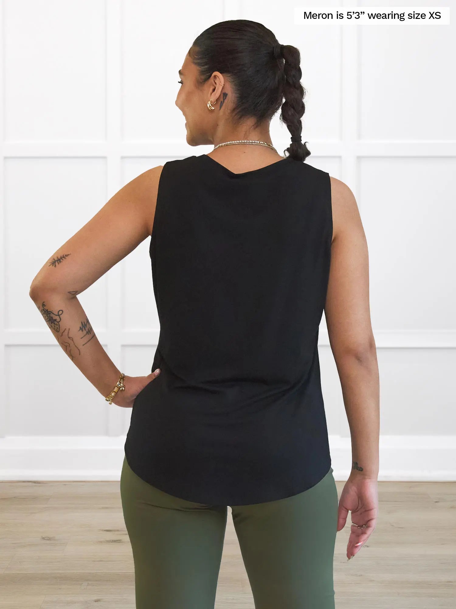Miik model Meron (5’3”, xsmall) standing with her back towards the camera showing the back of Miik&
