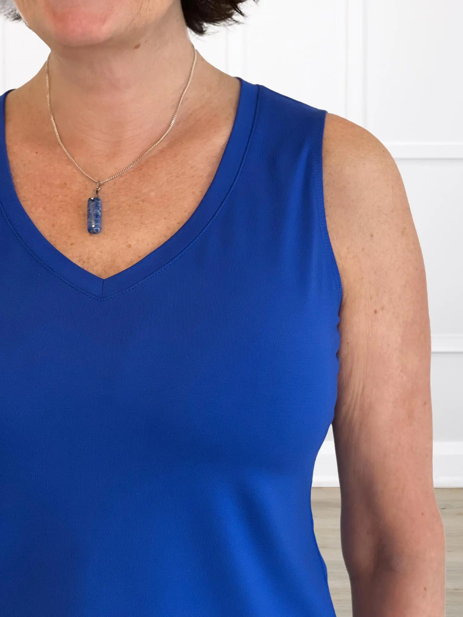 A closeup image of the v-neck of Miik&
