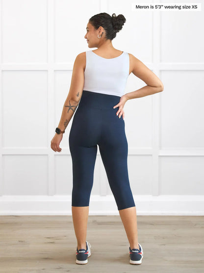 Miik model Meron (5’3”, xsmall) standing with her back towards the camera showing the back of Miik&