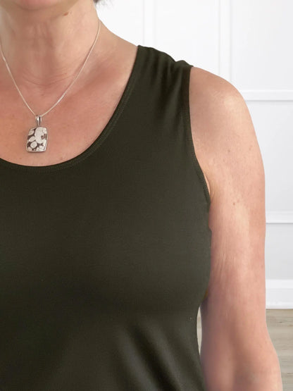 A closeup detail of the neckline of Miik&