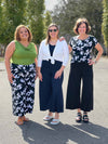 Miik models Carley and Christal along with founder Donna standing next to each other smiling showing different ways of styling the Miik's Keethai wide leg culotte and its different colours and print 