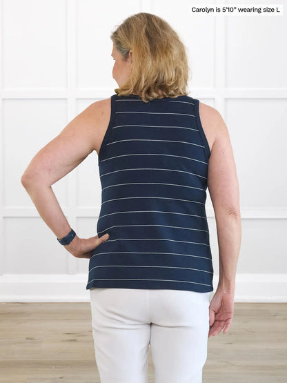 Miik model Carolyn  (5’10”, large) standing with her back towards the camera showing the back of Miik&