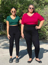 Miik models Meron and Sarita smiling both wearing Miik's Lisa2 high waisted legging in black along with a classic v-neck tee