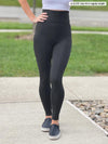 Miik model Johanna (size XS, five foot six) wearing the Lisa2 high waisted legging in regular length, in charcoal grey.