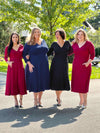 Miik models Yasmine, Kelly and Bri along with Miik founder Donna standing next to each other all wearing the same dress: Lolly midi flounce dress with pockets