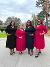 Miik models plus size Kimesha, Jennifer, Erica and Sureka standing next to each other smiling all wearing Miik's Lolly midi flounce dress with pockets in the colour available: black, bordeaux and navy