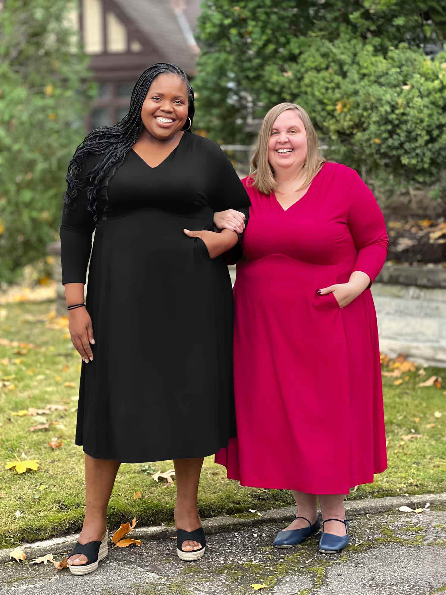 Miik model plus size Kimesha and Jennifer standing next to each other smiling both wearing Miik&