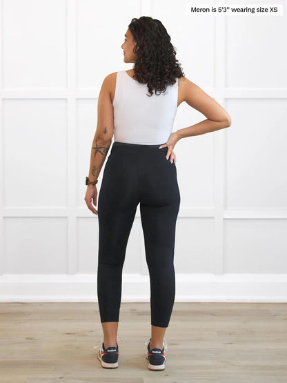 Miik model Meron (5’3”, xsmall) standing with her back towards the camera showing the back of Miik&