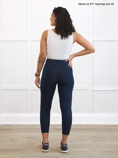 Miik model Meron (5’3”, xsmall) standing with her back towards the camera showing the back of Miik&