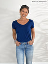 Miik model Bonnie (5'0", xsmall, petite) smiling wearing Miik's Marianna reversible classic tee in ink blue with jeans 