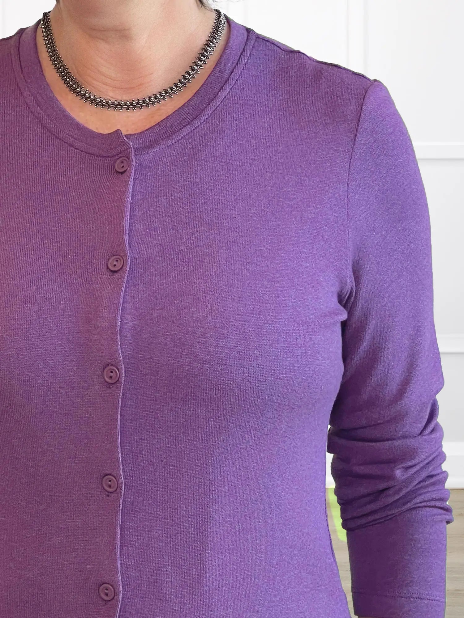 A closeup detail shot of the neckline of Miik&