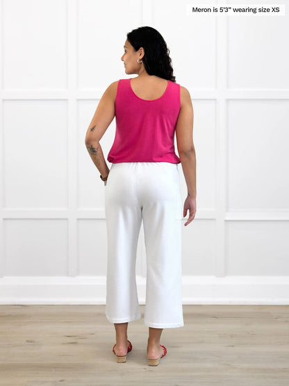 Miik model Meron (5’3”, xsmall) standing with her back towards the camera showing the back of Miik&