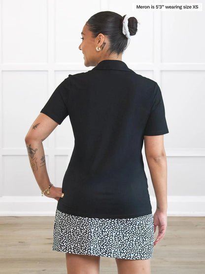 Miik model Meron (5’3”, xsmall) standing with her back towards the camera showing the back of Miik&