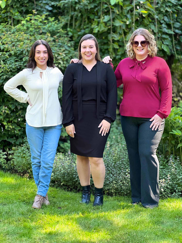 Miik models Yasmine, Christal and Bri all wearing different colours and ways to tie the new Miik's Rhoda tie neck blouse 