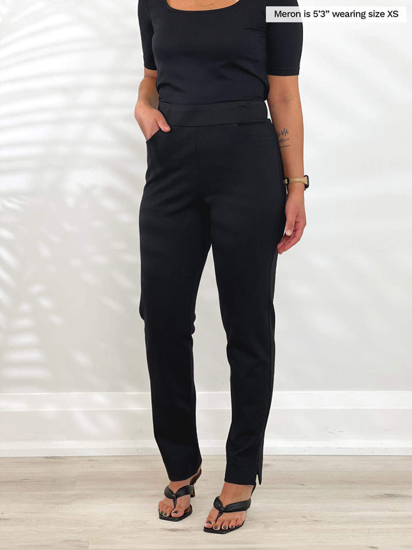 A side close up image of Miik's Roma pull-on straight leg ankle pant in black size xsmall