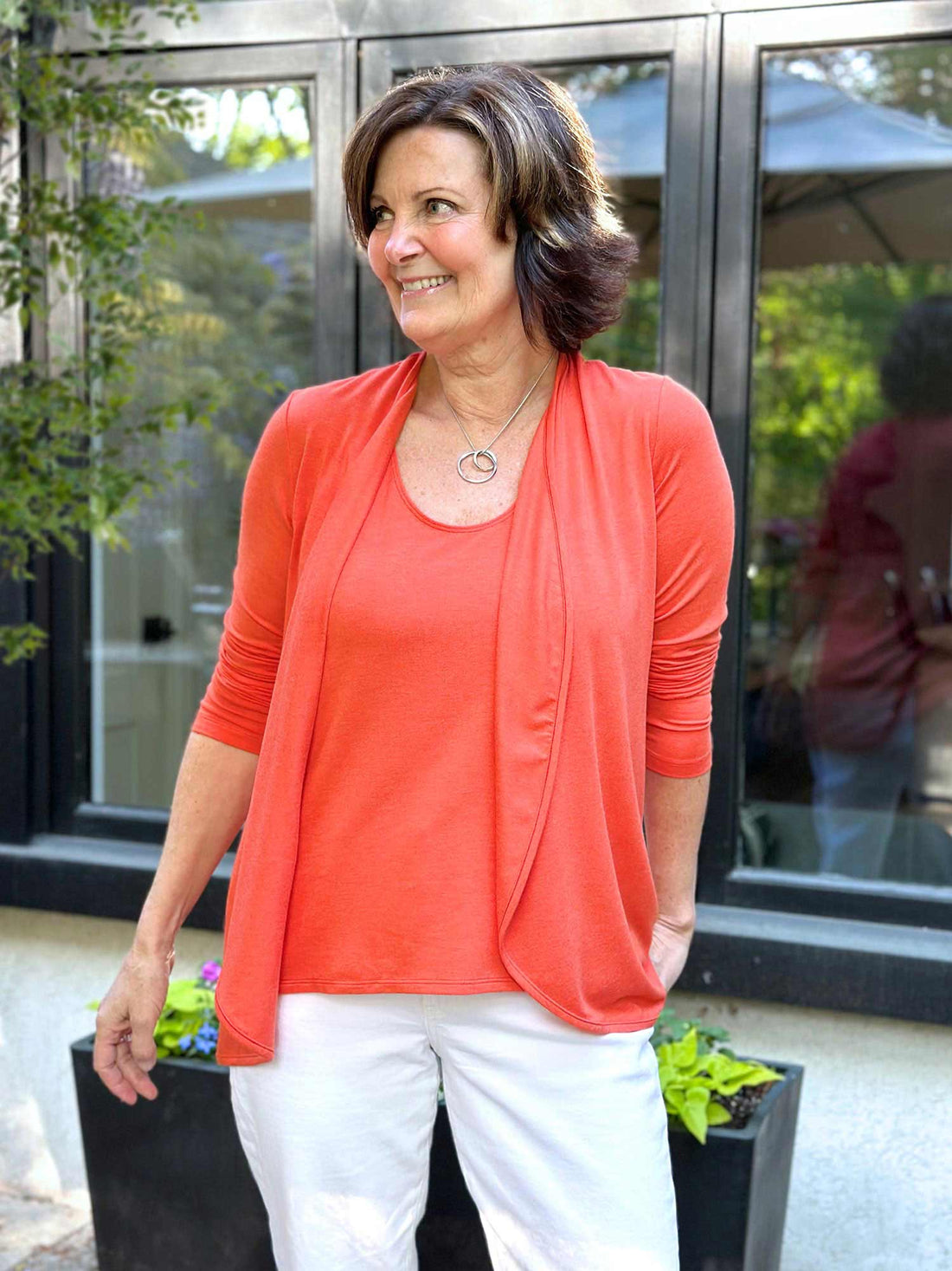 Woman standing in nature wearing Miik&