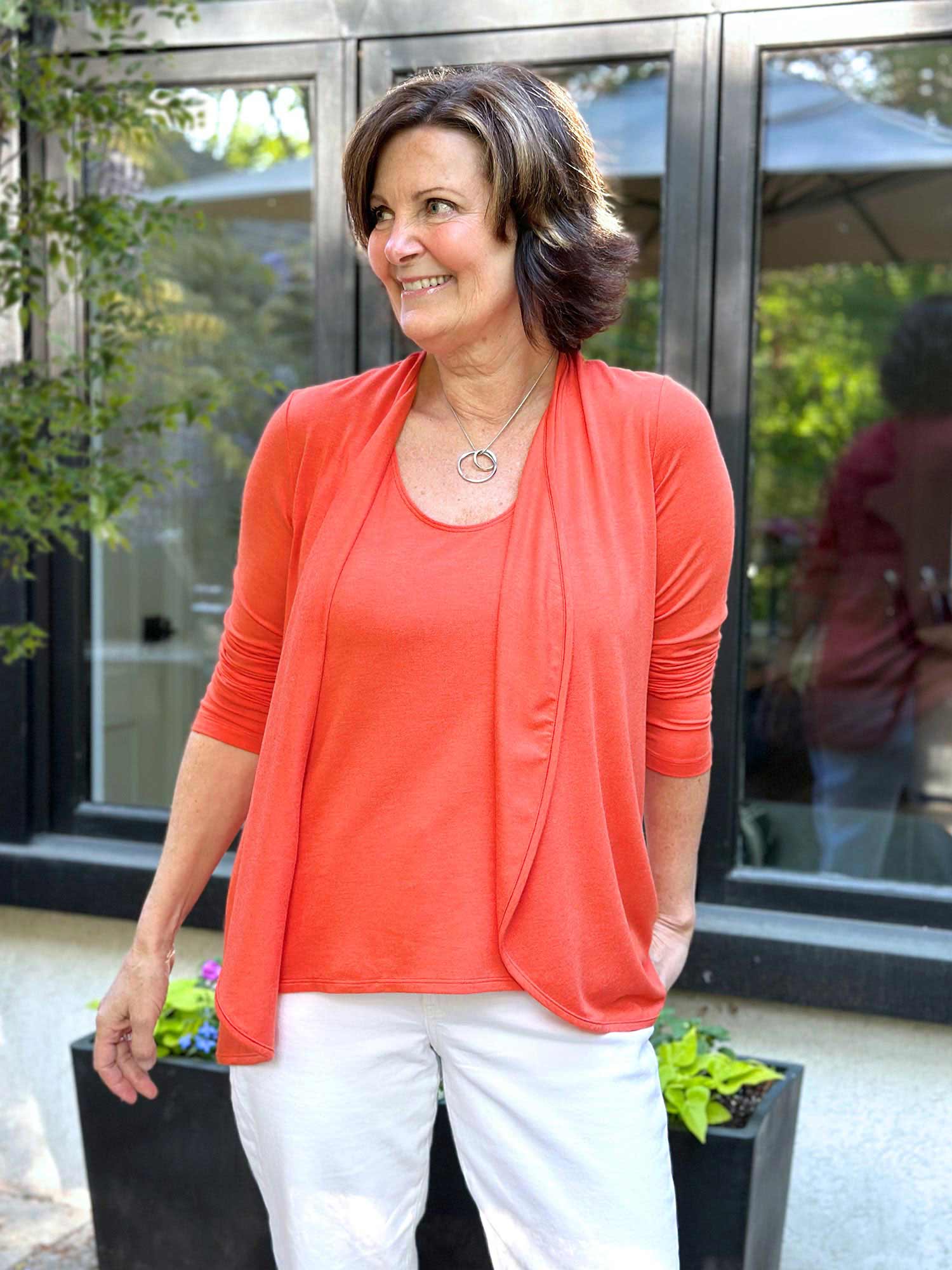 Woman standing in nature wearing Miik&