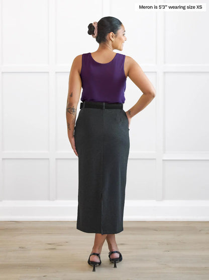 Miik model Meron (5’3”, xsmall) standing with her back towards the camera showing the back of Miik&