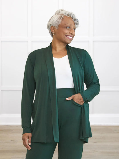 Woman wearing a green outfit with a white background