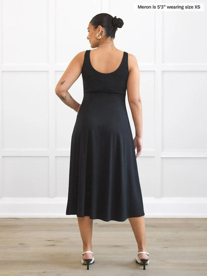 Miik model Meron (5’3”, xsmall) standing with her back towards the camera showing the back of Miik&