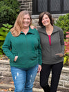 Miik model Kelly and founder Donna smiling both wearing Miik's Shaelyn full zip luxe fleece jacke. Kelly is wearing in the jade melange colour while Donna is wearing in granite