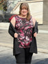 Miik model Bri (55", xlarge) smiling wearing Miik&